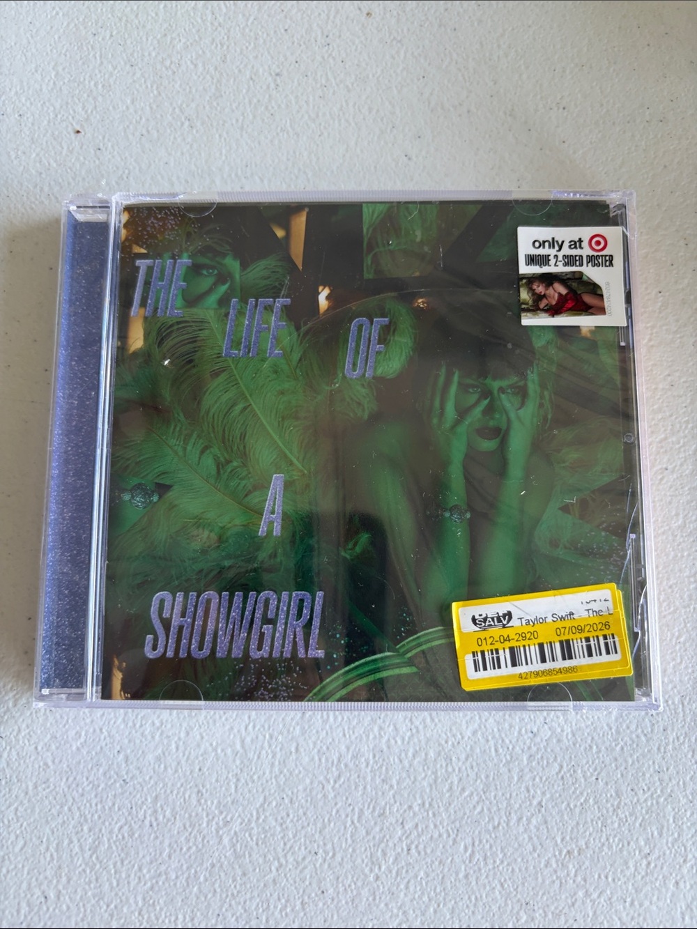 The Life of a Showgirl CD — green & purple cover